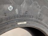 a close up of a tire on a white surface