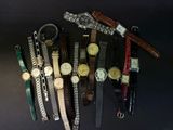 a lot of watches that are sitting together on the table