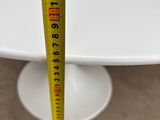 a measuring tape that is on top of a cake plate