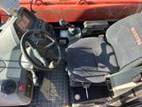 a picture of a tractor with a steering wheel and dashboard