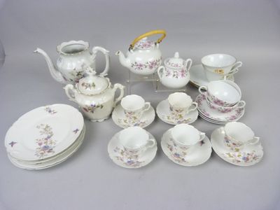 many different types of tea and coffee sets on the table