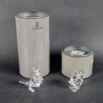 two pieces of glass sitting next to a can