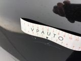 a sticker on the hood of a car that has a tape on it