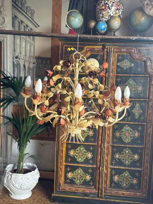 a plant that is sitting on a table in front of a cabinet