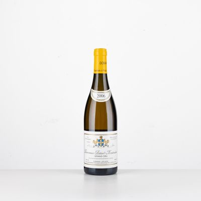 a bottle of white wine sitting on top of a table