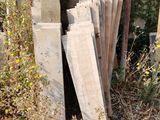 a pile of wood sitting in the middle of a field