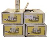 four boxes of wine are stacked on top of each other with a bottle of wine in the middle