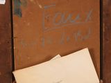 a piece of paper and a piece of paper on a piece of wood