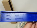 someone is holding a blue box that has a blue label on it