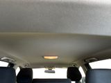 the back of a car with the sunroof down and the back seats down
