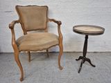 a chair and a small table on a concrete floor