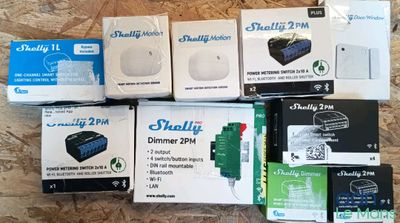 several boxes of electronics sitting on top of a wooden table