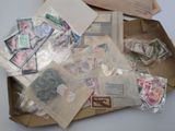 a box full of stamps and envelopes on a table