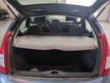 the back of a car with the trunk open and the seats down