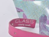 a pink wristband with a name on it and a pink wristband with a name on it