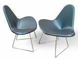 pair of blue chairs with metal legs on a white background