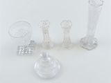 several pieces of glass sitting on top of a table next to each other