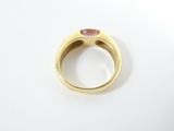 an image of a gold ring with a pink stone in the middle