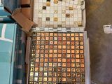 a box of chocolates on a pallet next to a box of chocolates
