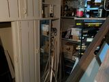 a garage with a lot of clutter and tools in it