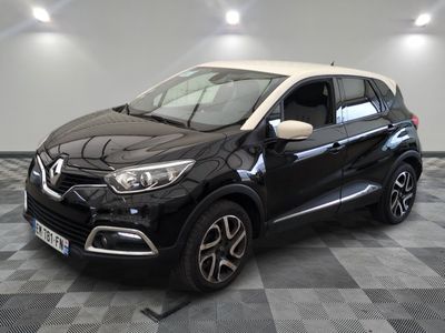 a black and white car parked on a checkered floor