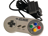 a video game controller that is connected to a charger