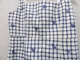 a picture of a blue and white checkered dress hanging on a hanger