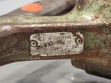a close up of a piece of metal with a tag on it