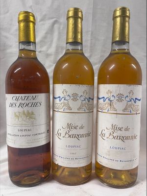 three bottles of wine sitting next to each other on a table