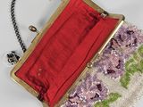 clutch bag made of beads and fabric with a red lining