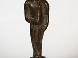 bronze statue of a man holding a baby on a square base