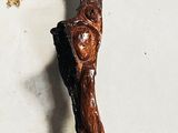 a wooden stick that is on display on a table