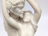 marble statue of a woman and a man holding each other