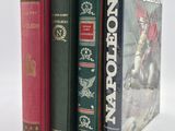 three books that are sitting next to each other on a table
