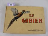 une image représentant un livre sur lequel figure l'illustration d'un faisan en plein vol