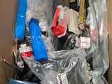 a cardboard box full of electronic devices and other items