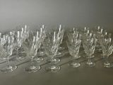 a lot of wine glasses sitting on a table