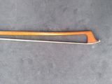 an image of a long wooden stick with a long handle