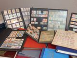 a lot of different types of stamps on a table