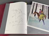 a book with a picture of a man riding a horse in the snow