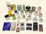 many different types of perfumes on a white surface