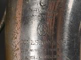 a close up of a silver vase on a table