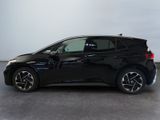 the bmw i3 is parked in a showroom with a white wall