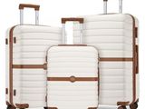 three pieces of luggage sitting on top of each other on wheels