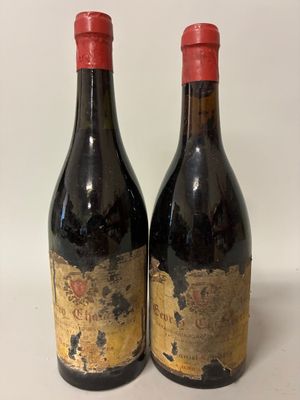 two bottles of wine are sitting next to each other on a table