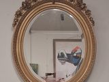 a mirror hanging on the wall in a room