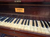 a piano that is sitting in a room