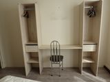 a bed and a chair in a small room