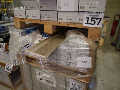 many boxes on the shelves of a store with price tags