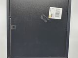 a close up of a metal door with a sticker on it
